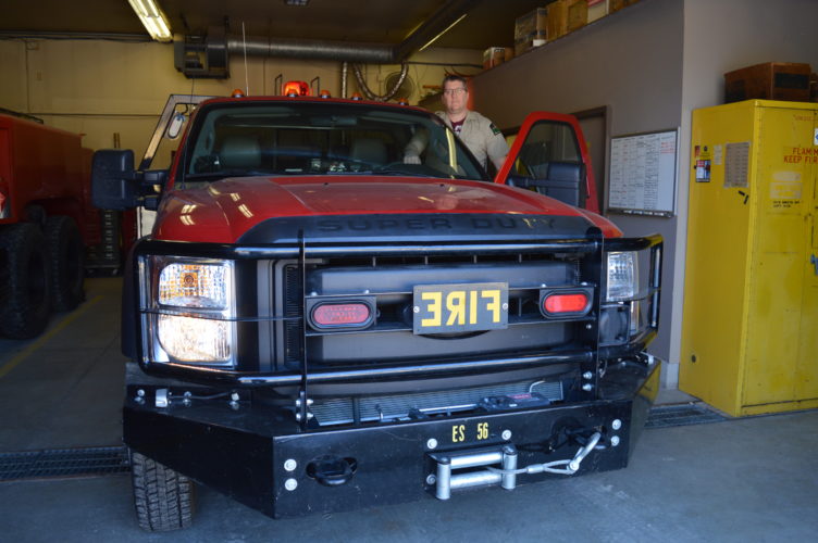 Jordan Beck | Daily Press Forest Fire Officer for the DNR's Escanaba Management Unit Jay Osterberg is pictured with a vehicle used by the unit. Osterberg said this year's wildfire season is expected to be a particularly busy one in the area.